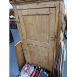 AN ANTIQUE PINE CUPBOARD.