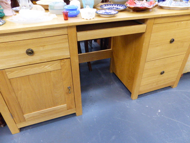 A LARGE OAK DESK.