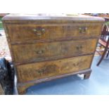 A GEORGIAN WALNUT CHEST OF THREE GRADUATED DRAWERS.