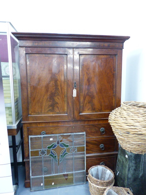 AN EARLY 19th.C.MAHOGANY WARDROBE.