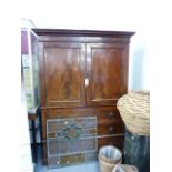 AN EARLY 19th.C.MAHOGANY WARDROBE.