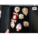 A QUANTITY OF SILVER GILDED ENAMEL MEDALS.