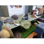 VINTAGE MILITARY CAMP BED, MILITARY TIN HATS, GAS MASKS,ETC.
