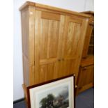 A LARGE OAK WARDROBE.