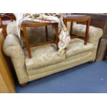 A SMALL TWO SEATER SETTEE.