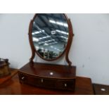 A REGENCY MAHOGANY SWING MIRROR.