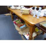 A LARGE PINE KITCHEN TABLE.