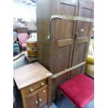 A SMALL OAK CABINET AND AN OAK WARDROBE.