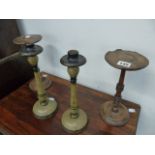 A PAIR OF TREEN STANDS AND A PAIR OF CANDLESTICKS.
