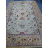 A LARGE PERSIAN PATTERN RUG.