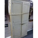 AN ANTIQUE PAINTED PINE FOUR DOOR CUPBOARD.