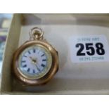 A GOLD LADIES FOB WATCH WITH ENAMEL DECORATION.