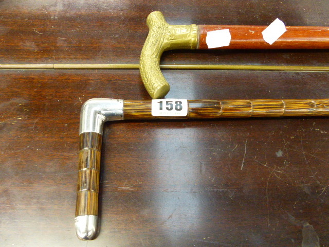 A SILVER MOUNTED WALKING STICK AND ONE OTHER.