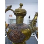 A LARGE TIBETAN BRASS KETTLE.