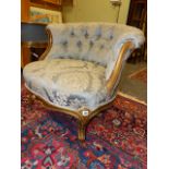 A 19th.C.BUTTON BACK TUB ARMCHAIR WITH GILT PAINTED SHOW FRAME.