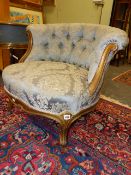 A 19th.C.BUTTON BACK TUB ARMCHAIR WITH GILT PAINTED SHOW FRAME.