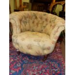 A 19th.C.BUTTON UPHOLSTERED TUB ARMCHAIR ON TURNED FORELEGS WITH BRASS CASTERS.