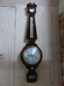 A REGENCY MAHOGANY AND BOXWOOD STRUNG FOUR GLASS WALL BAROMETER WITH SILVERED DIALS SIGNED D.