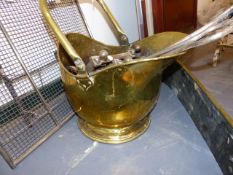 A GROUP OF VARIOUS FIRESIDE TOOLS TOGETHER WITH A SPARK GUARD, A COAL SCUTTLE AND A BRASS FENDER.