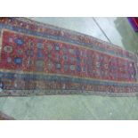 AN ANTIQUE PERSIAN TRIBAL RUNNER 300 X 110 CM