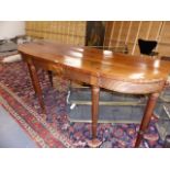 AN EARLY 19th.C.MAHOGANY TALL BREAK BOW FRONT SERVING TABLE ON TURNED REEDED LEGS. POSSIBLE
