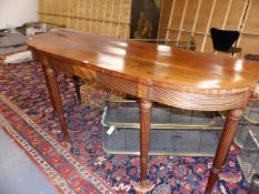 AN EARLY 19th.C.MAHOGANY TALL BREAK BOW FRONT SERVING TABLE ON TURNED REEDED LEGS. POSSIBLE