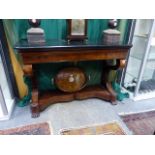 A FRENCH EMPIRE FLAME MAHOGANY CONSOLE OR SERVING TABLE WITH BLACK SLATE TOP. W.130 x H.87cms.