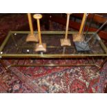 A BRASS FRAMED GLASS TOPPED COFFEE TABLE WITH UNDERTIER. 121 x 46cms.