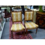 A PAIR OF FRENCH LOUIS XVI STYLE CARVED WALNUT SIDE CHAIRS ON TURNED SUPPORTS.