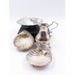 A SILVER HALLMARKED MILK JUG DATED 1759 LONDON,TOGETHER WITH THREE SILVER HALLMARKED SHELL DISHES.