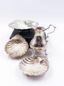 A SILVER HALLMARKED MILK JUG DATED 1759 LONDON,TOGETHER WITH THREE SILVER HALLMARKED SHELL DISHES.