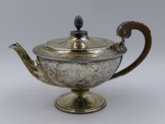 AN EDWARDIAN SILVER HALLMARKED FOOTED TEAPOT. MARKERS MARK JAMES DIXON & SONS LTD, DATED 1918.