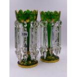 A PAIR OF LATE VICTORIAN GREEN GLASS TABLE LUSTRES WITH FACETED GLASS DROPPERS EMBELLISHED WITH GILT