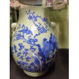 A LARGE CHINESE CELADON GLAZE BALUSTER FORM VASE WITH APPLIED ELEPHANT MASK RING HANDLES, BIRD AND