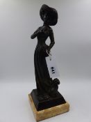 A BRONZE FIGURAL GROUP OF AN ELEGANT LADY WITH HER DOG ON MARBLE BASE. H. 38cms.