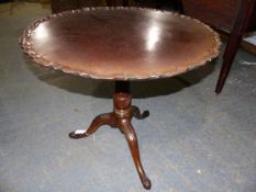 A GEORGIAN MAHOGANY TRIPOD TABLE WITH PIE CRUST DISH TOP