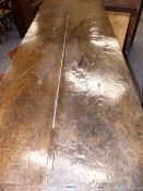 AN IMPRESSIVE 17th.C.AND LATER OAK REFECTORY TABLE WITH TWO PLANK TOP OVER CARVED FRIEZE, TURNED