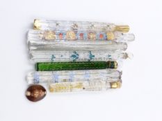 SEVEN VICTORIAN ELONGATED SCENT BOTTLES WITH PAINTED DECORATIONS.