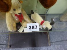 A COLLECTION OF SEVEN STEIFF TEDDY BEARS AND A STEIFF DOG.