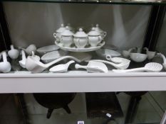 A COLLECTION OF ANTIQUE AND LATER CONTINENTAL WHITE GLAZED SERVING PIECES TO INCLUDE POT DE CREME