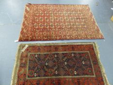 AN ANTIQUE BELOUCH RUG. 155 x 94cms. TOGETHER WITH AN ANTIQUE TEKKE BOKHARA RUG. 190 x 138cms. (2)