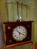 A HOROLOVAR FLYING PENDULUM DESK CLOCK.