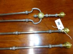 A GOOD RARE SET OF GEORGIAN STEEL AND BRASS MOUNTED FIRESIDE TOOLS WITH SHAPED HANDLES AND BRASS