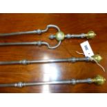 A GOOD RARE SET OF GEORGIAN STEEL AND BRASS MOUNTED FIRESIDE TOOLS WITH SHAPED HANDLES AND BRASS