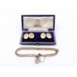 A 9ct ROSE GOLD CHARM BRACELET TOGETHER WITH A PAIR OF PRECIOUS YELLOW METAL CUFFLINKS,