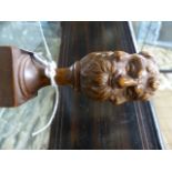 A FINELY CARVED TREEN ORNAMENT WITH GROTESQUE MASK KNOP FINIAL. H.9cms.