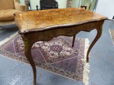 A 19th.C.WALNUT FOLD OVER CARD TABLE OF SERPENTINE OUTLINE WITH GILT BRASS MOUNTED CABRIOLE LEGS.