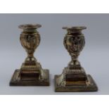 A PAIR OF SILVER HALLMARKED VICTORIAN DWARF CANDLESTICKS, RICHARD HODD & SON, LONDON 1885. THE URN