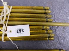 A SET OF BRASS ROUND SECTION STAIR RODS. 17 x L.107cms, APPROX. D.12mm., TOGETHER WITH 4 x L.