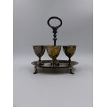 AN ANTIQUE VICTORIAN SILVER HALLMARKED EGG CRUET SET HAVING FOUR REMOVABLE EGG CUPS. WILLIAM